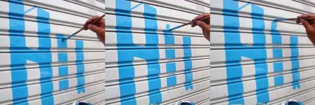 シャッターに文字・作業中1(大阪府大阪市)